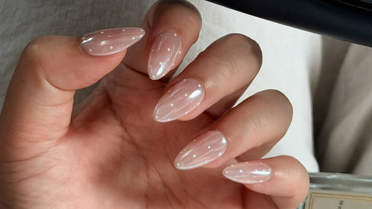 Natural nude press-on nails applied for a secure, salon-quality fit