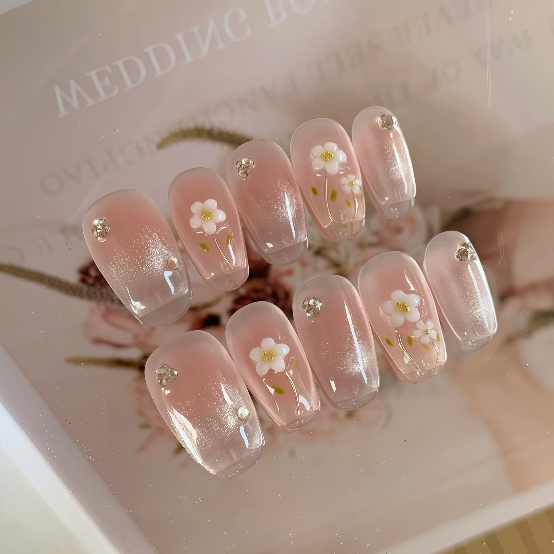soft nude pink nails with flowers and shimmer
