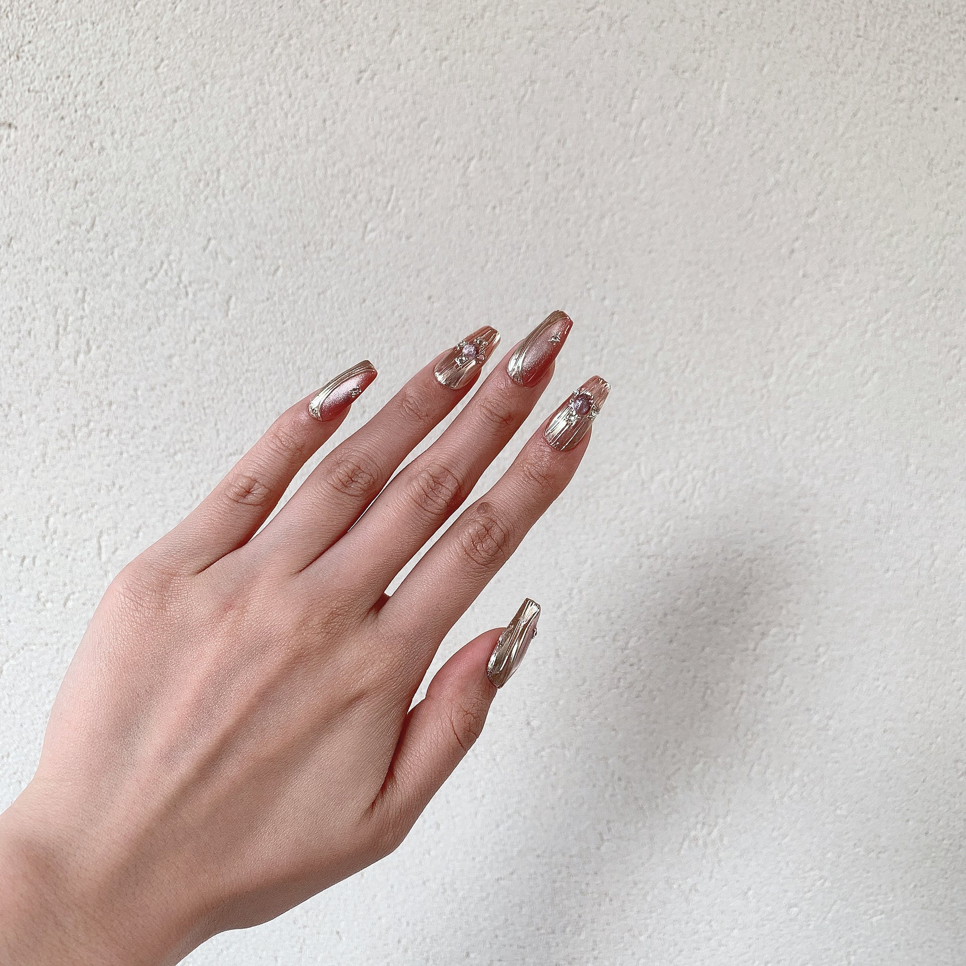 clean girl nude nails with metallic edge