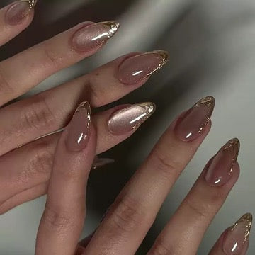 clean girl nude press on nails with gold detail