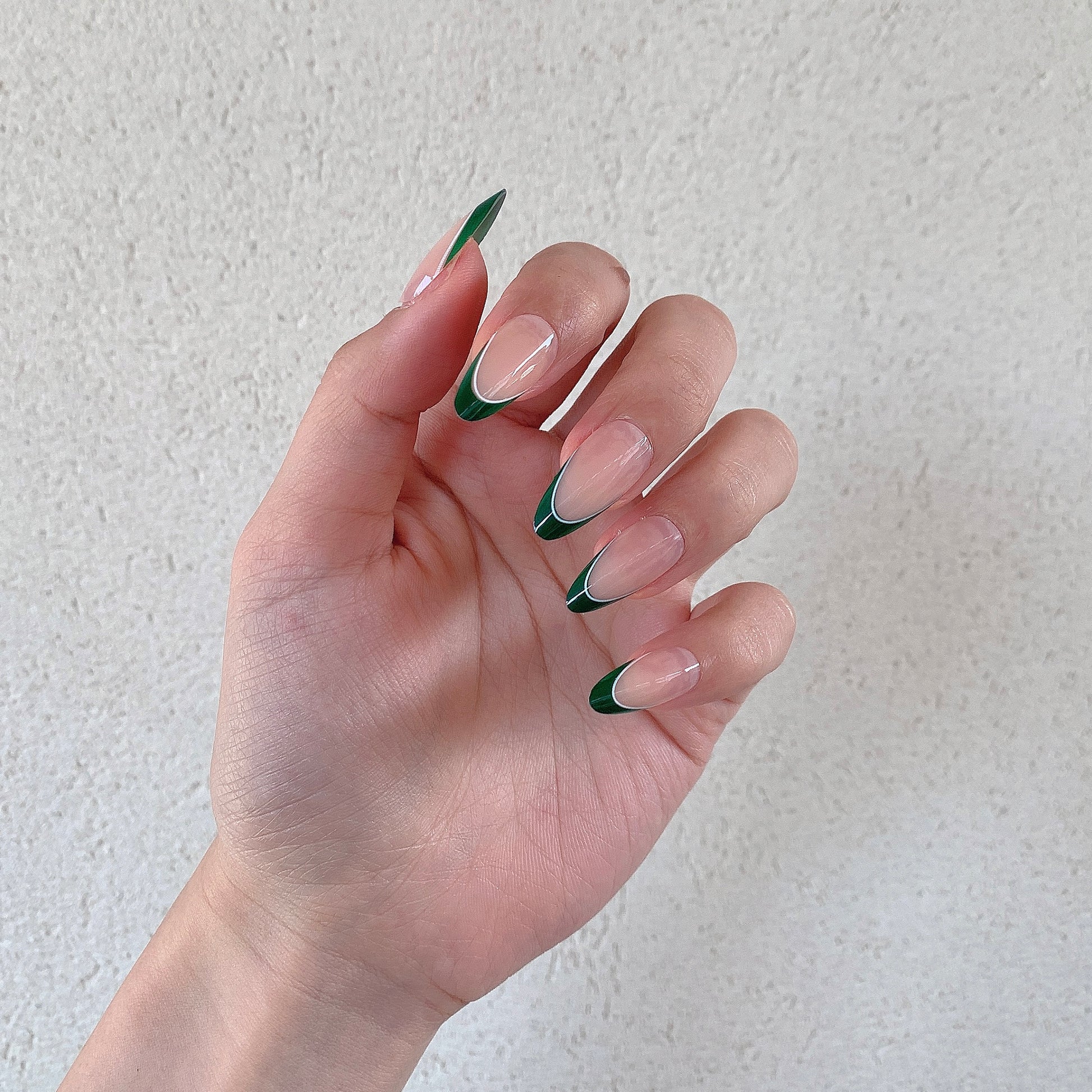 minimal nude nails with green tips modern french design