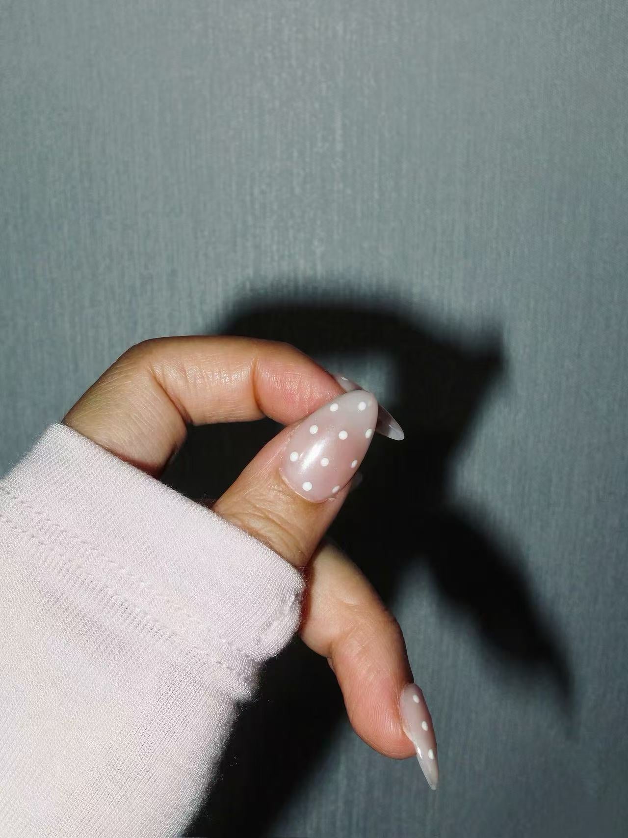 glossy nude press on nails with cute dot design
